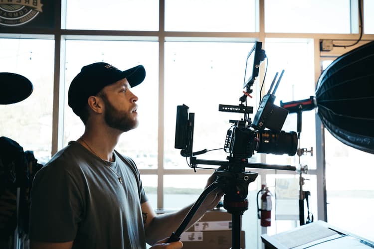 Person behind a camera filming