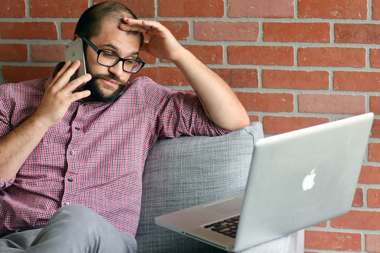 Frustrated business owner switching website hosting providers